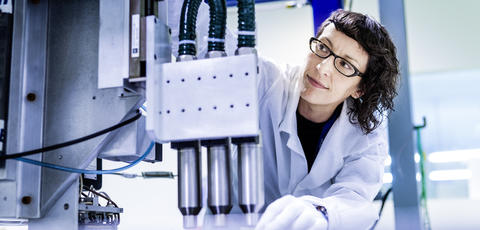 Engineer woman in Spain working on plasma equipment