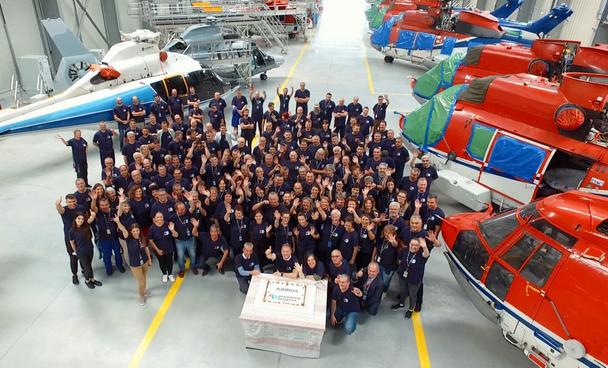 Team members at Airbus Helicopters Romania mark Airbus’ 50th anniversary with a group photo. 