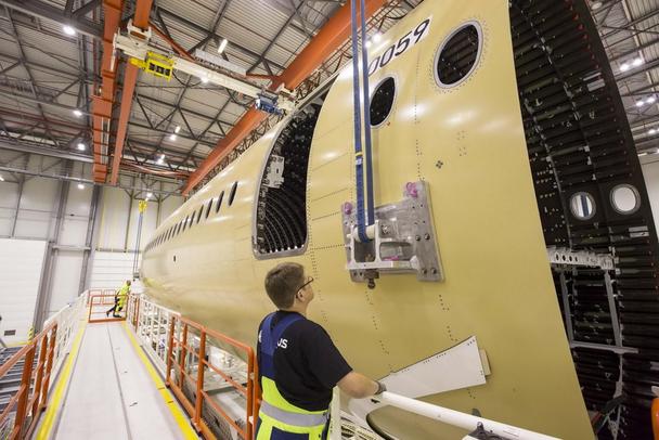 Build-up of the first forward fuselage section of the A350-1000 began in Hamburg. Once equipped, the component will be delivered to Saint-Nazaire, France for join-up with the initial nose fuselage section. A350-1000_1st_front_fuselage_in_Hamburg.jpg