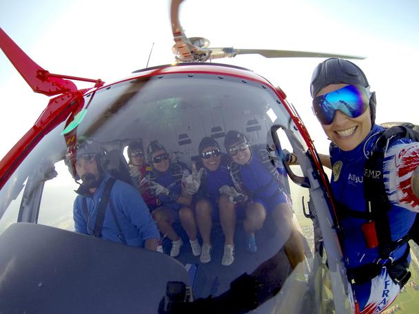 Members of the Ang’elles pose for a special team photo during the Parachute World Cup competition in Thalgau, Austria