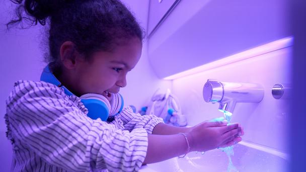 A330neo Touchless features used by child in A330neo Airspace cabin