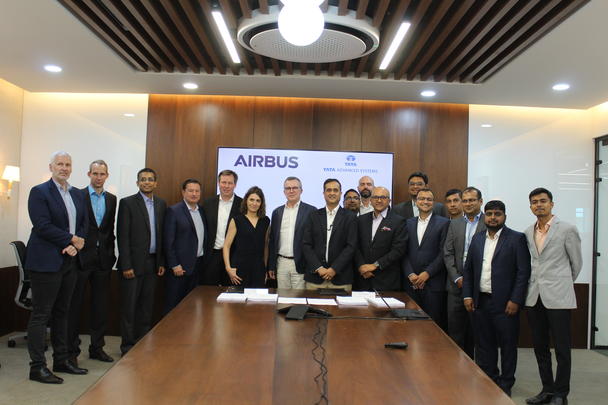 Airbus and Tata Advanced Systems Ltd. teams pose after signing the contract for the manufacturing of A320 cargo doors at Hyderabad on March 29, 2023