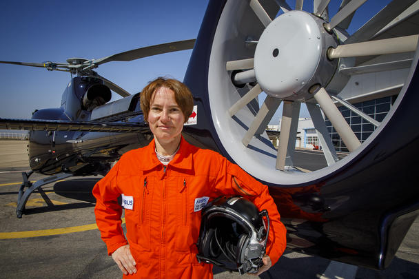 Anne Ducarouge in front of an H130