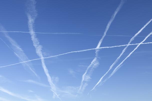 contrails on blue sky
