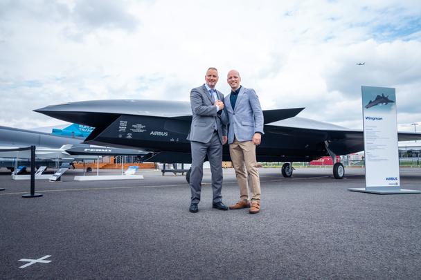 Michael Schoellhorn, CEO at Airbus Defence and Space (on the left), and Gundbert Scherf, Co-CEO at Helsing, in front of the Airbus Wingman model. Michael Schoellhorn, CEO at Airbus Defence and Space (on the left), and Gundbert Scherf, Co-CEO at Helsing, in front of the Airbus Wingman model.
