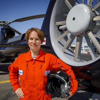 Anne Ducarouge in front of an H130