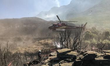 An Airbus-built rotorcraft operated by Mont Blanc Helicoptères supports firefighting efforts, complementing ground crews. An Airbus-built rotorcraft operated by Mont Blanc Helicoptères supports firefighting efforts, complementing ground crews.