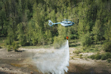 Hillsboro Aviation's H145 releasing water from bucket Hillsboro Aviation's H145 releasing water from bucket