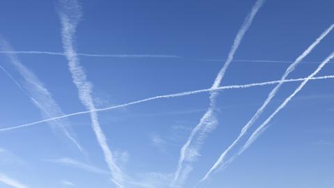 contrails on blue sky