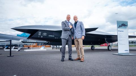Michael Schoellhorn, CEO at Airbus Defence and Space (on the left), and Gundbert Scherf, Co-CEO at Helsing, in front of the Airbus Wingman model.