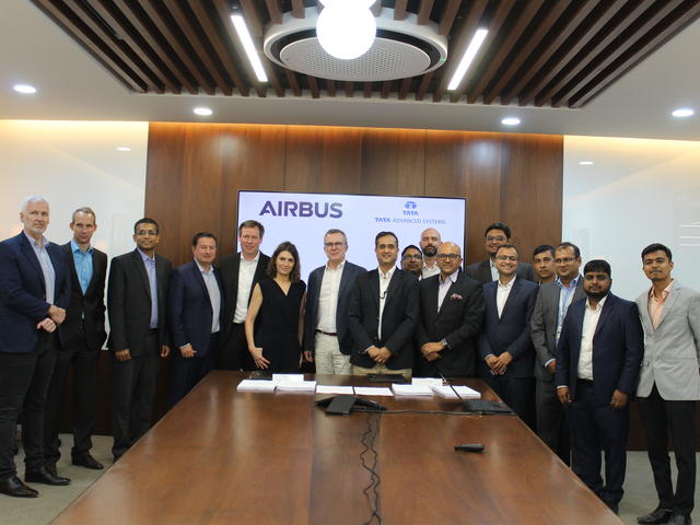 Airbus and Tata Advanced Systems Ltd. teams pose after signing the contract for the manufacturing of A320 cargo doors at Hyderabad on March 29, 2023