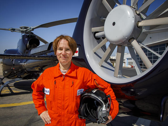 Anne Ducarouge in front of an H130