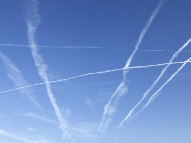 contrails on blue sky