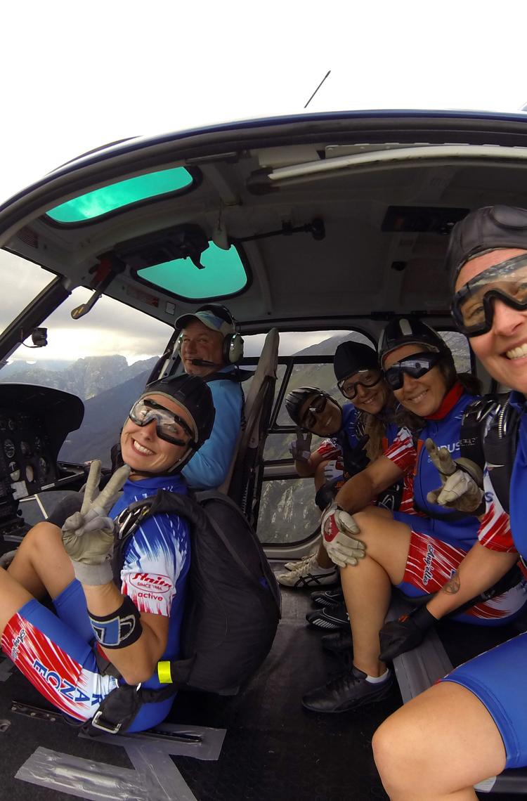 Five members of the Airbus-sponsored Ang’elles parachute team are ready for a group jump during international competition
