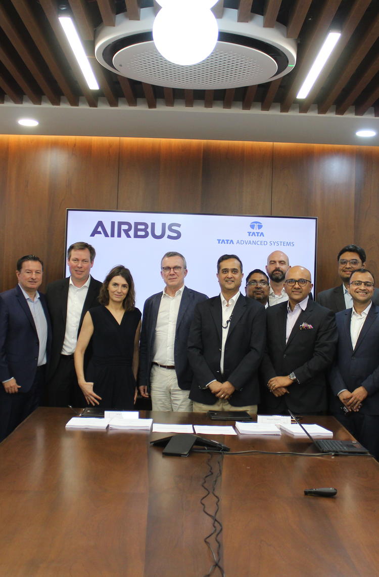Airbus and Tata Advanced Systems Ltd. teams pose after signing the contract for the manufacturing of A320 cargo doors at Hyderabad on March 29, 2023