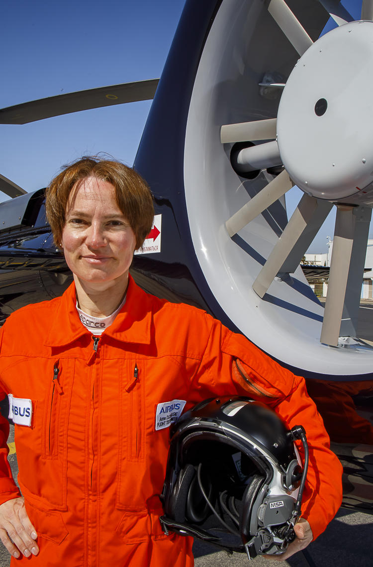 Anne Ducarouge in front of an H130