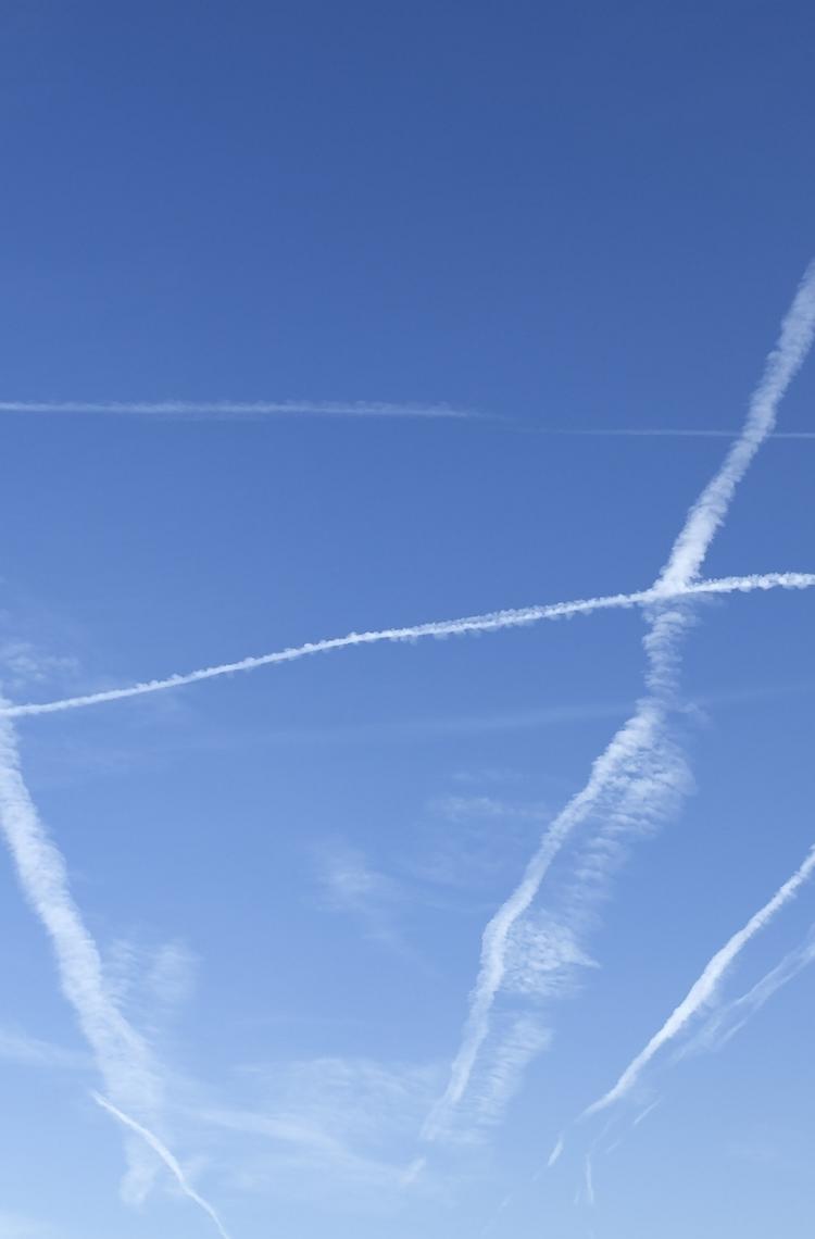 contrails on blue sky