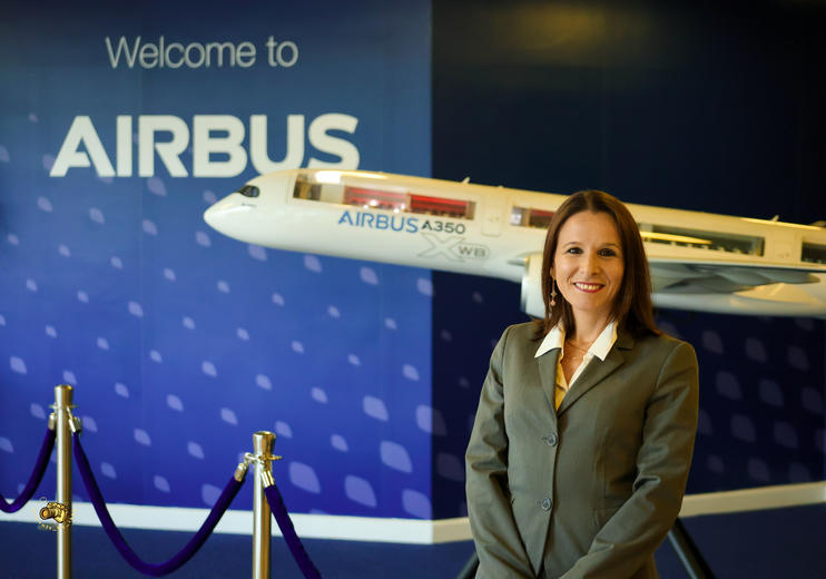 Valentina standing in front of a model of the A350XWB