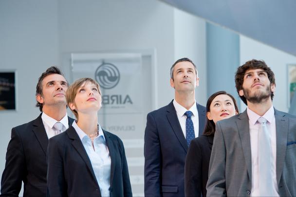 business people watching an Airbus aircraft